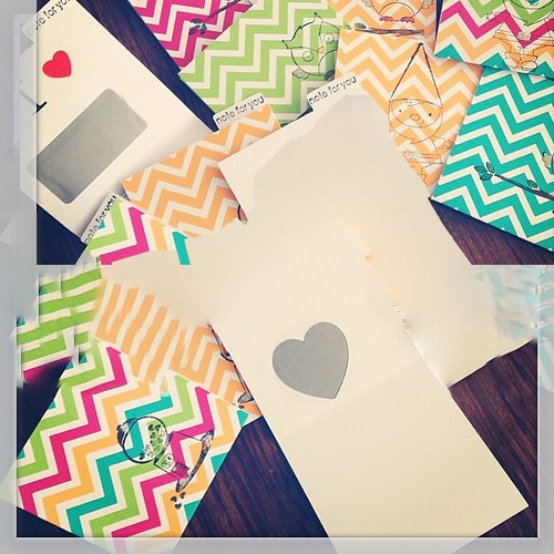 colorful cards; one has a gray heart to scrath off.