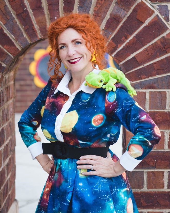 Ms. Frizzle with her chameleon