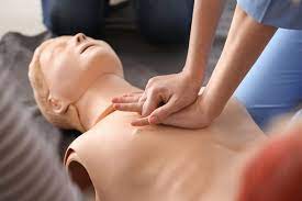 two hand position on CPR dummy