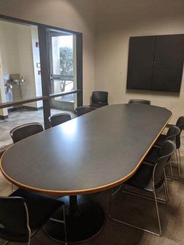 1st Floor Conference Room interior image showing conference table with chairs