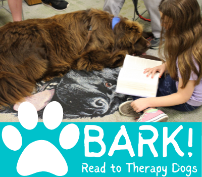 Girl reading a book to a large brown dog with the text Bark! Read to Therapy Dogs below