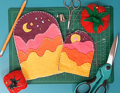 felt charms embroidered to look like a sunset 