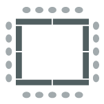 Chairs placed at tables facing the center of the room, creating an enclosed square